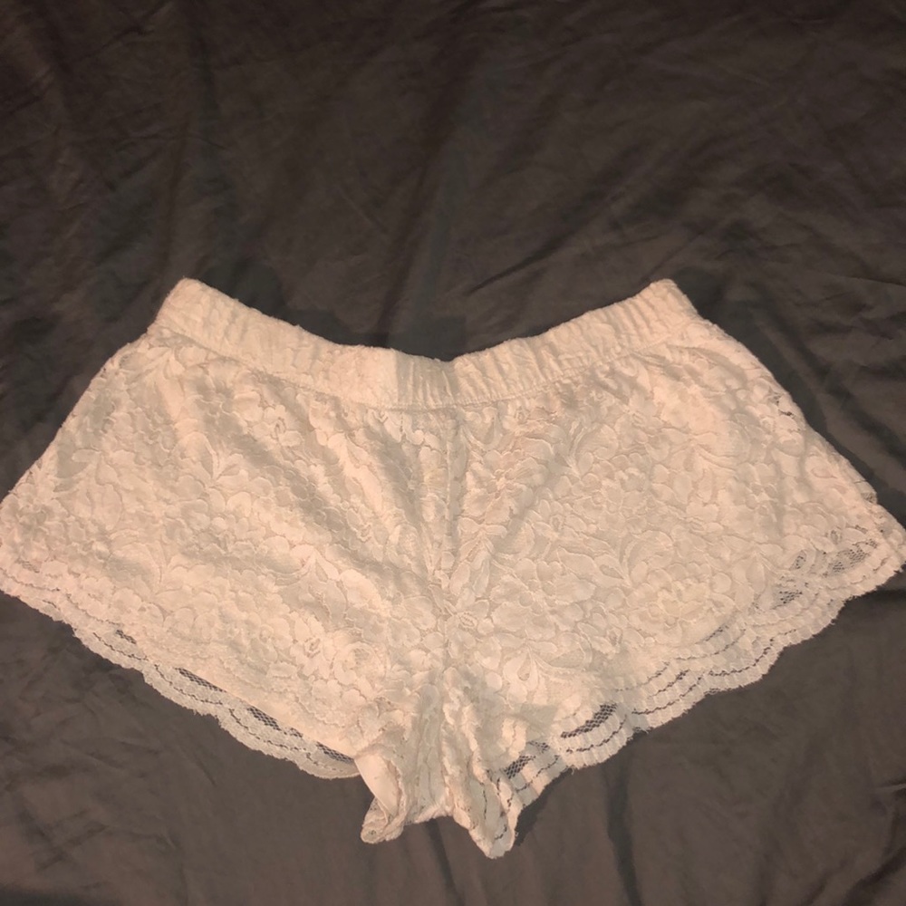 Off white flowy shorts with floral lace pattern